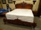 SOLID MAHOGANY KING SIZE BED WITH HIGHLY CARVED HEADBOARD AND FOOTBOARD WITH SOLID WOOD RAILS.