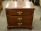 MAHOGANY 3 DRAWER NIGHTSTAND WITH BRASS PULLS AND BRACKET FEET. MEASURES 21 IN X 14 IN X 20.5 IN.