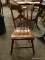 ANTIQUE ARROW BACK SIDE CHAIR WITH PLANK BOTTOM SEAT. MEASURES 17 IN X 20 IN X 33 IN. IS MISSING A
