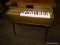 VINTAGE MAGNUS ELECTRIC KEYBOARD. MEASURES 29 IN X 12 IN X 32 IN. ITEM IS SOLD AS IS WHERE IS WITH