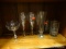 ASSORTED LOT OF GLASSWARE TO INCLUDE CHAMPAGNE FLUTES, A PILSNER GLASS, SHERRY GLASSES, AN ICED TEA