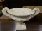 DOUBLE HANDLED OFF-WHITE URN STYLE PLANTER. MADE IN MEXICO. MEASURES 15 IN X 10 IN. ITEM IS SOLD AS