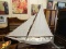MODEL SAILING SHIP MADE BY LIPSCOMBE IN KILMARNOCK, VA. IS WHITE AND BURGUNDY IN COLOR. MEASURES 47