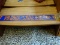 UVA VIRGINIA CAVALIERS ROAD SIGN IN BLUE AND ORANGE. MEASURES 42 IN X 6 IN. ITEM IS SOLD AS IS WHERE