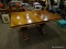 DOUBLE PEDESTAL DINING ROOM TABLE. MEASURES 62.5 IN X 43 IN X 30.5 IN. ITEM IS SOLD AS IS WHERE IS