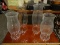 LOT OF 4 GLASS HURRICANE SHADES. TALLEST MEASURES 14 IN TALL. ITEM IS SOLD AS IS WHERE IS WITH NO