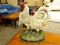CAST IRON ROOSTER AND HEN DOORSTOP. MEASURES 9 IN X 11.5 IN. ITEM IS SOLD AS IS WHERE IS WITH NO