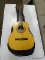 VINTAGE AMIGO BY LOTUS LEFT HANDED ACOUSTIC GUITAR WITH CASE. NEEDS TO BE TUNED. ITEM IS SOLD AS IS