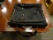 BLACK SUIT BAG WITH BROWN PIPED EDGING. ITEM IS SOLD AS IS WHERE IS WITH NO GUARANTEES OR WARRANTY,