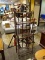 FOLDING METAL BAKERS RACK WITH, 4 SHELVES, SHELL AND ACANTHUS LEAF STYLE ACCENTS, A WINE BOTTLE
