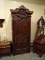 SOLID MAHOGANY HIGHLY CARVED WARDROBE WITH 1 DOOR THAT OPENS TO REVEAL AN INTERIOR SHELF AND 2