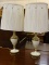 PAIR OF VINTAGE REMBRANDT BRASS AND CREAM COLOR PORCELAIN LAMPS WITH MILK GLASS SHADES AS WELL AS