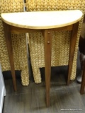 CYPRESS WOOD DEMILUNE TABLE. MEASURES 23 IN X 12 IN X 30 IN. ITEM IS SOLD AS IS WHERE IS WITH NO