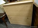 LATERAL FILING CABINET WITH FALL-FRONT STYLE DOORS THAT OPEN TO REVEAL INTERIOR SHELVES. MEASURES 34