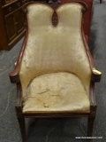 ANTIQUE FLORAL UPHOLSTERED ARM CHAIR WITH A PLUME CARVED CREST, ACANTHUS LEAF CARVED KNEES, AND
