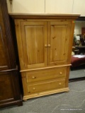 BROYHILL PINE ARMOIRE WITH 2 UPPER DOORS AND 2 LOWER DRAWERS. MEASURES 42 IN X 20 IN X 63 IN. ITEM