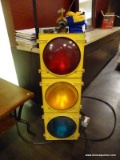 HANGING STOPLIGHT MAN CAVE DECORATION. HAS WORKING RED, YELLOW, AND GREEN LIGHTS THAT ARE OPERATED