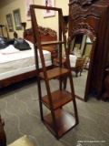LEANING LADDER BOOKCASE WITH 4 SHELVES FOR STORING BOOKS, COLLECTIBLES, ETC. ITEM IS SOLD AS IS