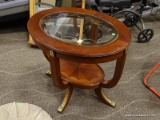 OVAL MAHOGANY END TABLE WITH CUT GLASS CENTER, BANDED TOP, REEDED LEGS WITH BRASS ACCENTS, AND A