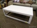 WHITE PAINTED COFFEE TABLE. MEASURES 51 IN X 28 IN X 16.5 IN. ITEM IS SOLD AS IS WHERE IS WITH NO