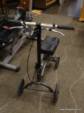 HANDICAP KNEE SCOOTER IN BLACK. MEASURES APPROXIMATELY 19 IN X 29 IN X 34 IN. ITEM IS SOLD AS IS