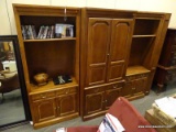 OAK 3 PIECE ENTERTAINMENT CENTER WITH 2 CENTER DOORS THAT OPEN TO REVEAL INTERIOR STORAGE OVER 1