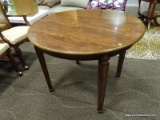 ROUND WOOD FINISH DINETTE TABLE WITH HEPPLEWHITE STYLE LEGS. MEASURES APPROXIMATELY 40 IN X 29 IN.