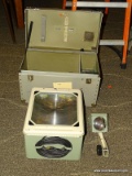VINTAGE PROJECTOR WITH CARRYING CASE AND PROJECTOR SHEETS. CASE MEASURES 21 IN X 12 IN X 15 IN. ITEM