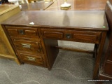 THOMASVILLE OAK 4 DRAWER DESK WITH BRASS HANDLES. MEASURES 46 IN X 18 IN X . ITEM IS SOLD AS IS