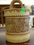 HAND CARVED AND SIGNED DECORATIVE BASKET WITH HANDLE. HAS IMAGES OF KOALA'S, OWLS, AS WELL AS OTHER
