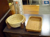 ASSORTED LOT OF ITEMS TO INCLUDE A WOVEN BASKET WITH STAND, A WICKER BASKET, AND A WOODEN PEDESTAL.