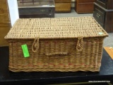 WICKER LIDDED BASKET WITH HANDLE. MEASURES 20 IN X 13 IN X 8 IN. ITEM IS SOLD AS IS WHERE IS WITH NO