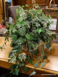 ARTIFICIAL IVY IN HANGING PLANTER. MEASURES APPROXIMATELY 24 IN X 23 IN. ITEM IS SOLD AS IS WHERE IS