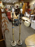 PAIR OF CREAM AND BRONZE TONED FLOOR LAMPS WITH ACANTHUS LEAF FINIALS. EACH MEASURES 65.5 IN TALL.