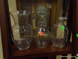 3 PIECE LOT OF GLASSWARE TO INCLUDE AN OLD QUAKER SYRUP BOTTLE, A STAR PATTERN BOTTLE, AND A CLEAR