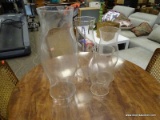 LOT OF 4 GLASS HURRICANE SHADES. TALLEST MEASURES 20 IN TALL. ITEM IS SOLD AS IS WHERE IS WITH NO