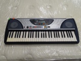 YAMAHA KEYBOARD IN BLUE AND GRAY. MODEL PSR-240. ITEM IS SOLD AS IS WHERE IS WITH NO GUARANTEES OR
