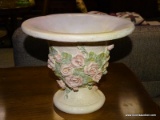 PLASTER COMPOTE WITH ROSE THEMED ACCENTS. MEASURES 10 IN X 8 IN. ITEM IS SOLD AS IS WHERE IS WITH NO