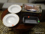 ASSORTED LOT TO INCLUDE BAKING PANS, A SOUP BOWL, AND A GERMAN THEMED TIN BOX. ITEM IS SOLD AS IS