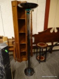 SILVER TONE TORCHIERE LAMP WITH ROUND BASE. MEASURES 72 IN TALL. SOME OF THE EPOXY HAS MELTED AND