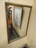 GOLD TONE FRAMED MIRROR. MEASURES 22 IN X 32 IN. ITEM IS SOLD AS IS WHERE IS WITH NO GUARANTEES OR