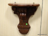 PAIR OF WALL HANGING CARVED MAHOGANY SHELVES. EACH MEASURES 14 IN X 16 IN. ITEM IS SOLD AS IS WHERE