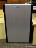 NUCOOL BRAND MINI FRIDGE IN BLACK AND SILVER WITH INTERIOR SHELVING. MEASURES 18 IN X 21 IN X 29 IN.