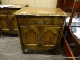 FRENCH PROVINCIAL NIGHTSTAND WITH 1 DRAWER OVER 2 DOORS WITH BRONZE TONED HARDWARE. MEASURES 25 IN X