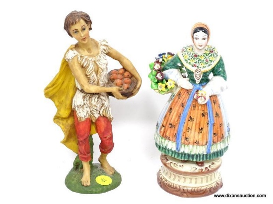 LOT OF 2 MADE IN ITALY FIGURINES. 1 IS OF A WOMAN GATHERING FRUIT AND 1 IS OF A WOMAN WITH A BASKET