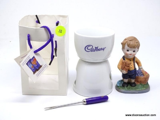 2 PIECE LOT TO INCLUDE A CADBURY CHOCOLATE FONDUE HOLDER WITH BOX, AND A SMALL FIGURINE OF A BOY