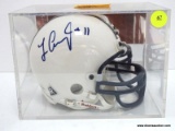 MINITURE HELMET SIGNED BY LAVAR ARRINGTON OF PSU AND WASHINGTON REDSKINS. ITEM IS SOLD AS IS WHERE
