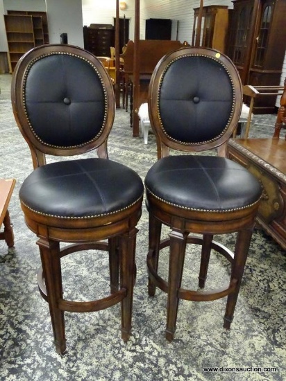 PAIR OF MAHOGANY AND BLACK LEATHER UPHOLSTERED SWIVEL BARSTOOLS WITH BUTTON TUFTED BACK AND BRASS