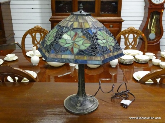 TIFFANY STYLE SLAGGED GLASS TABLE LAMP WITH BRONZE TONED BASE. MEASURES 24.5 IN TALL. ITEM IS SOLD