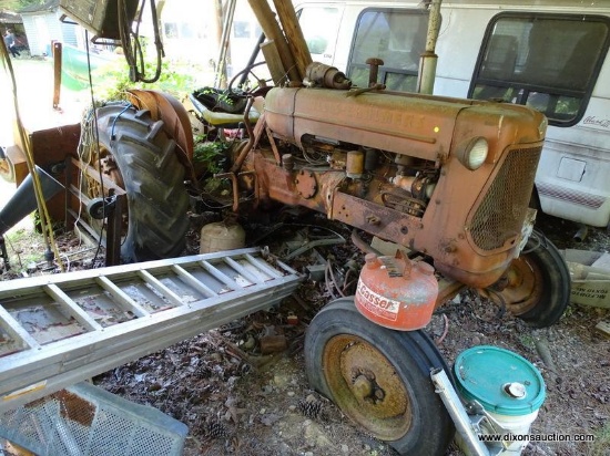 (OUT) VINTAGE ALICE-CHALMERS TRACTOR. NEEDS FUEL PUMP AND POSSIBLY OTHER PARTS. FRONT TIRES ARE
